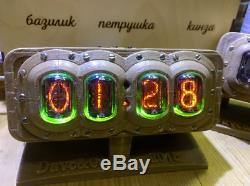 Nixie Tube Clock in a plastic case in the steampunk style on gas lamps